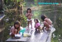 Children Playing in the Amazon River in a small village near